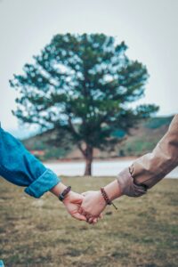 couple holding hands love calculator